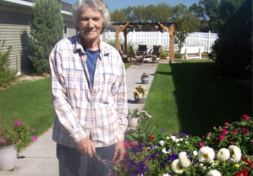 Older Woman Gardening | Assisted Living