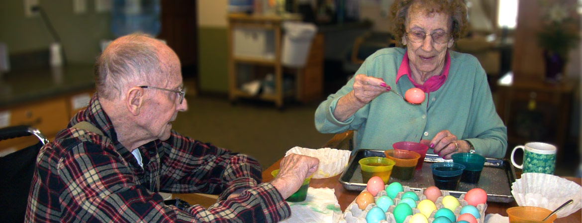 Assisted Living residents coloring Easter eggs